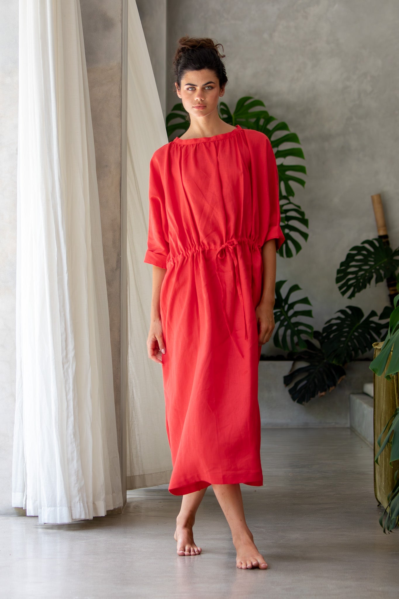 close shot of model wearing red linen moments dress, made in Australia 