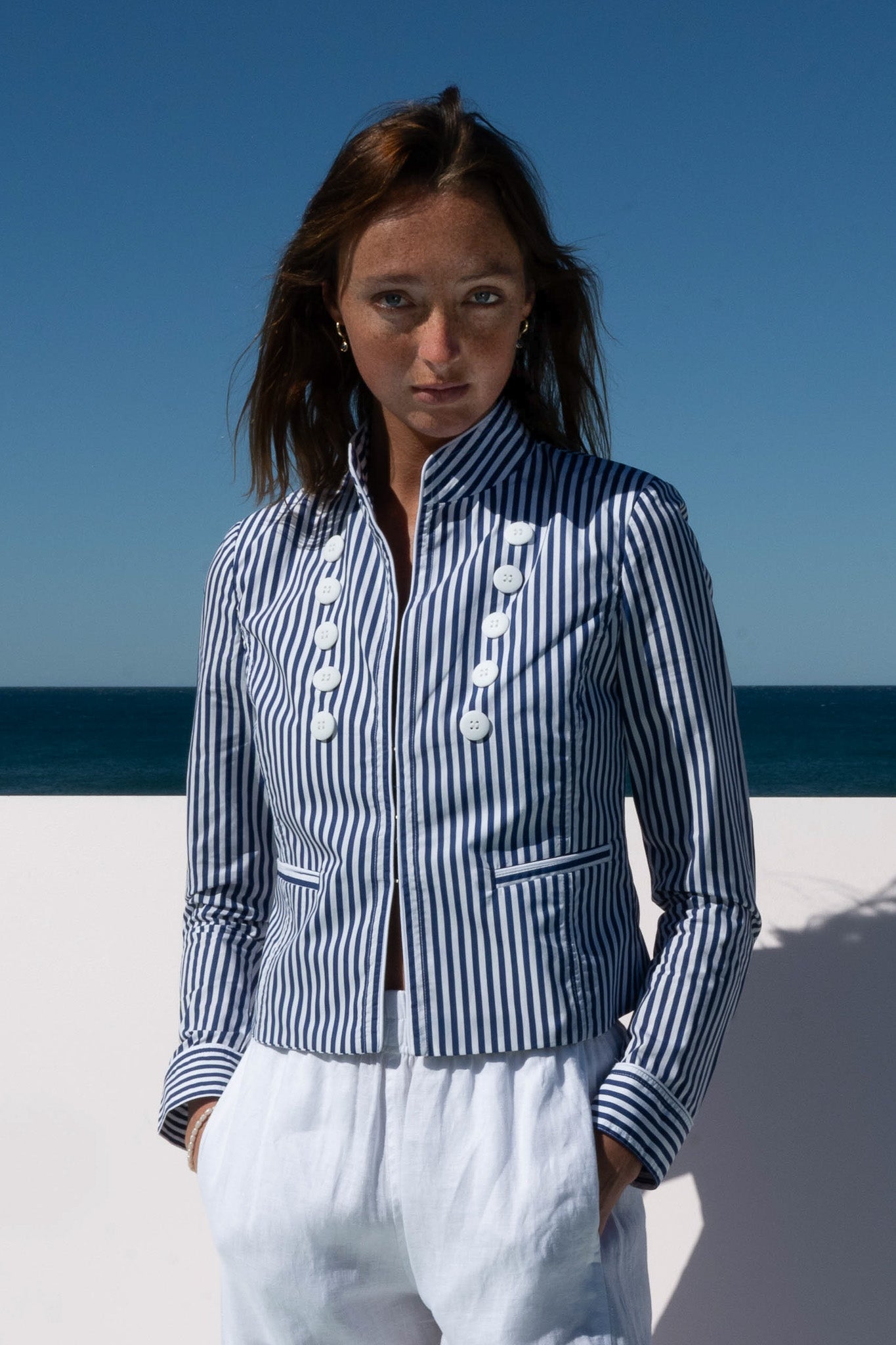 Close-up of the Abbey Road Jacket in azure stripe cotton poplin with white statement buttons.