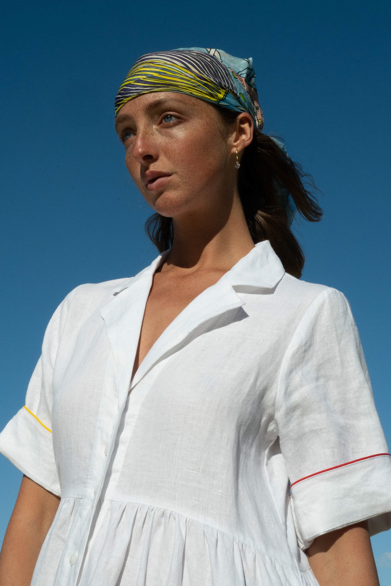 Front close-up of the Siena Dress highlighting collared neckline and contrast sleeve piping.