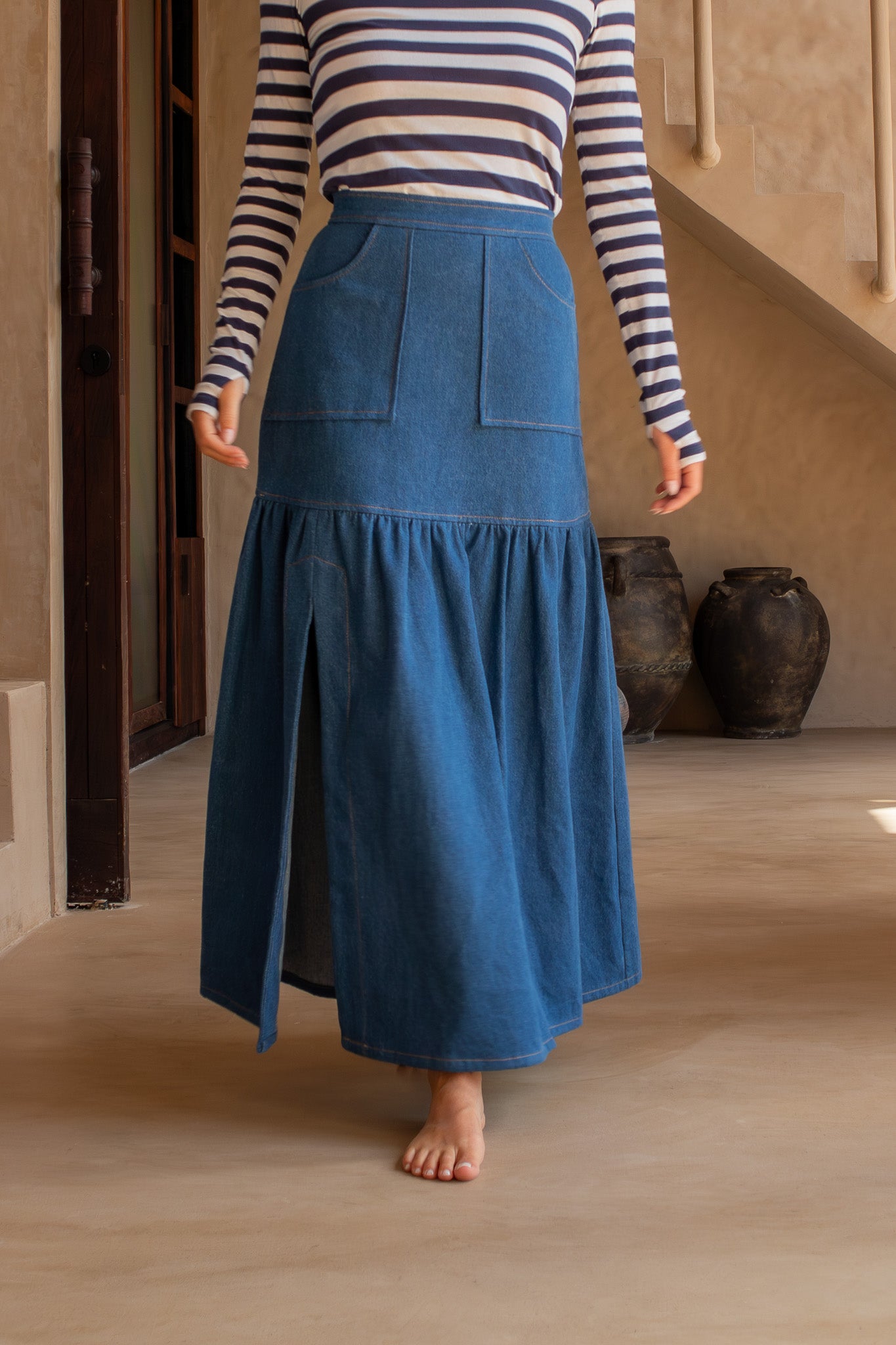 Close-up of The Boy and I Cancan Skirt in denim, showing front pockets and gathering detail, styled with a striped top.