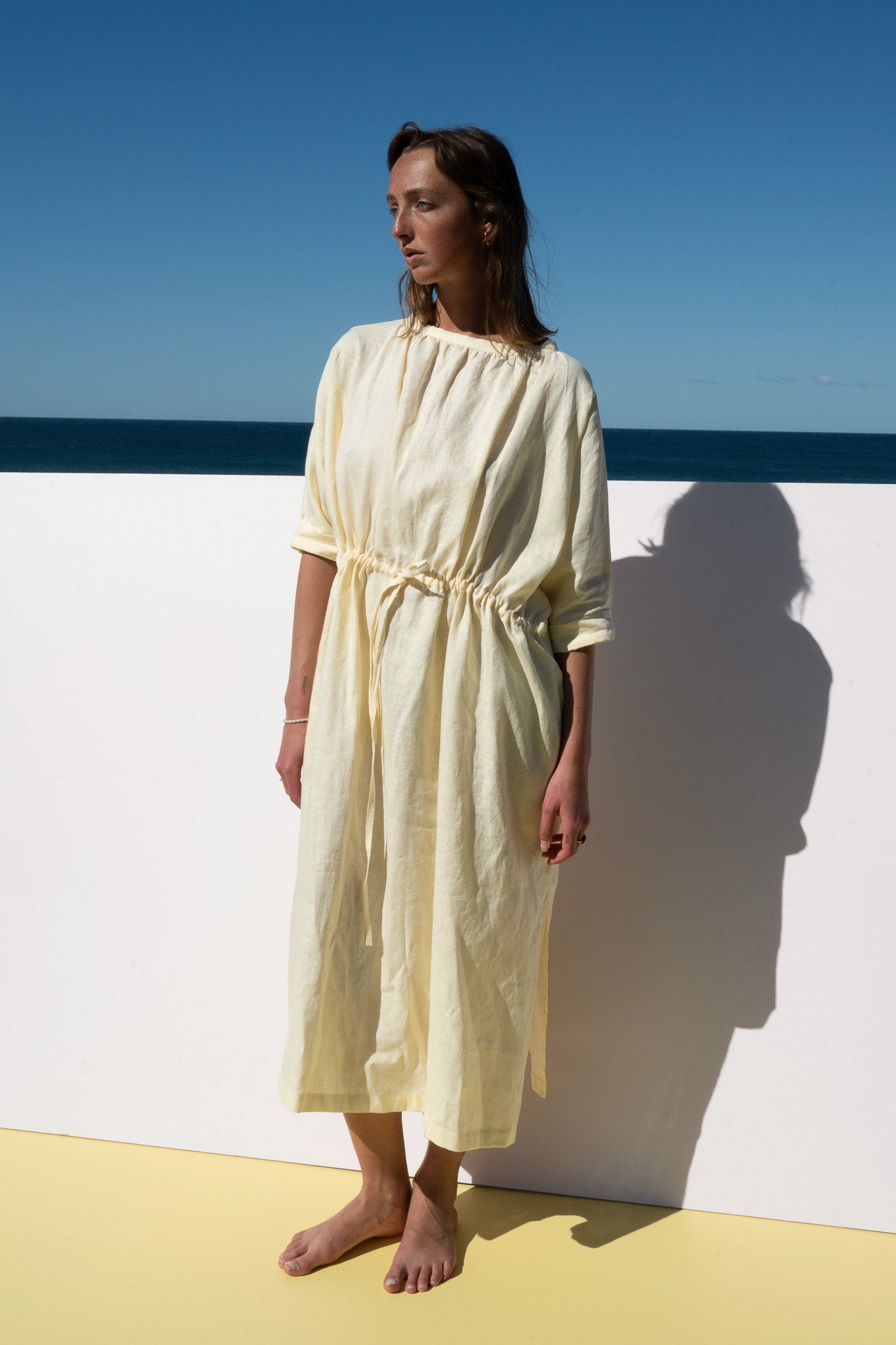The Moments Dress in yellow linen – full length front view with drawstring waist