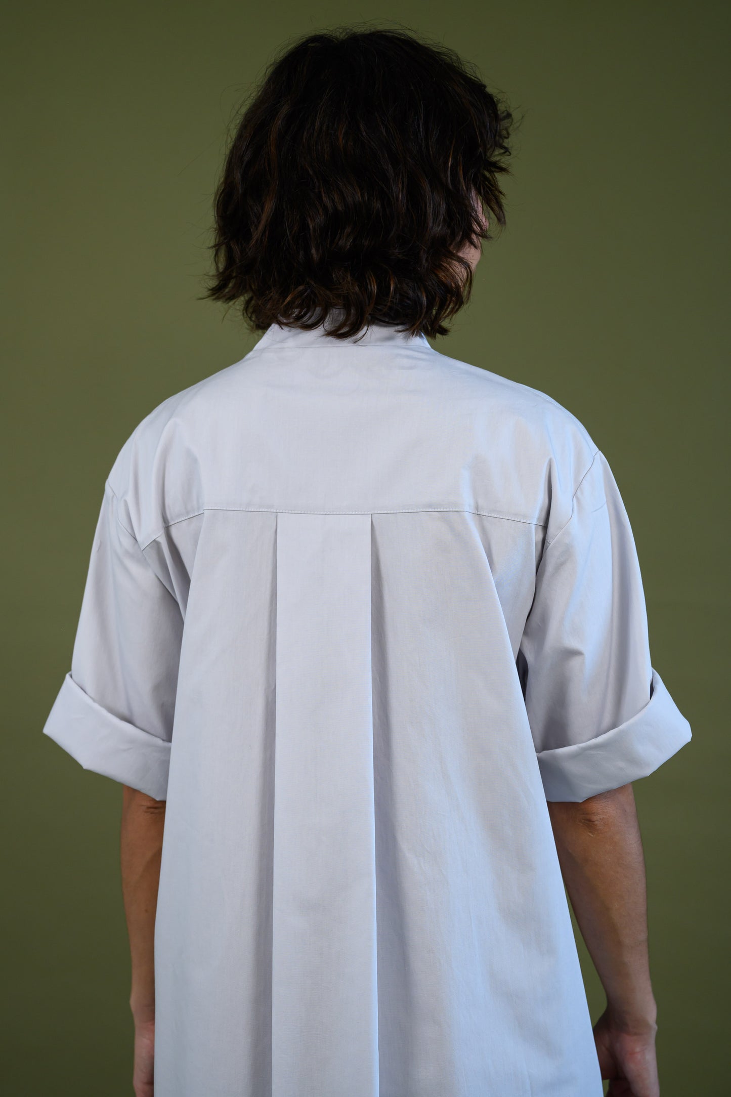 Back detail of white cotton poplin dress showing seam lines and construction