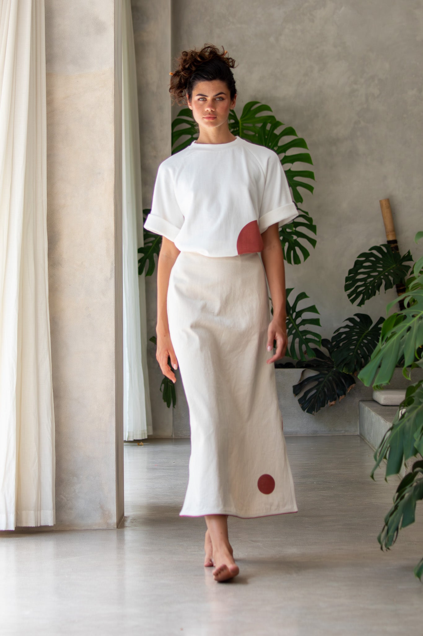 Front walking shot of model wearing Denim skirt from designer clothing label The Boy&I 