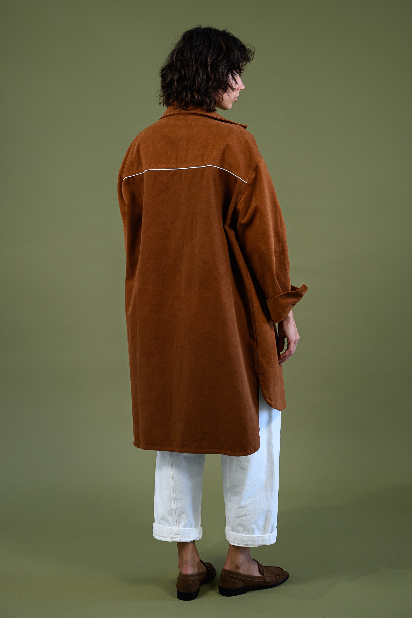 Full length back view of caramel cotton canvas denim shirt coat.