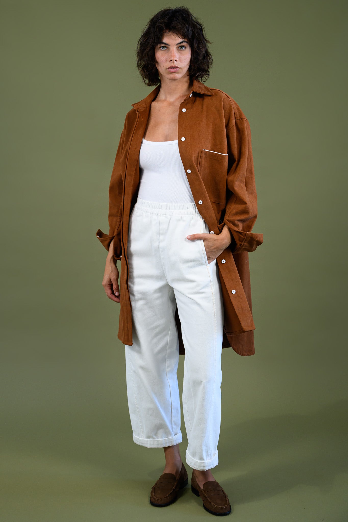 Caramel cotton canvas denim shirt coat shown in movement with open front