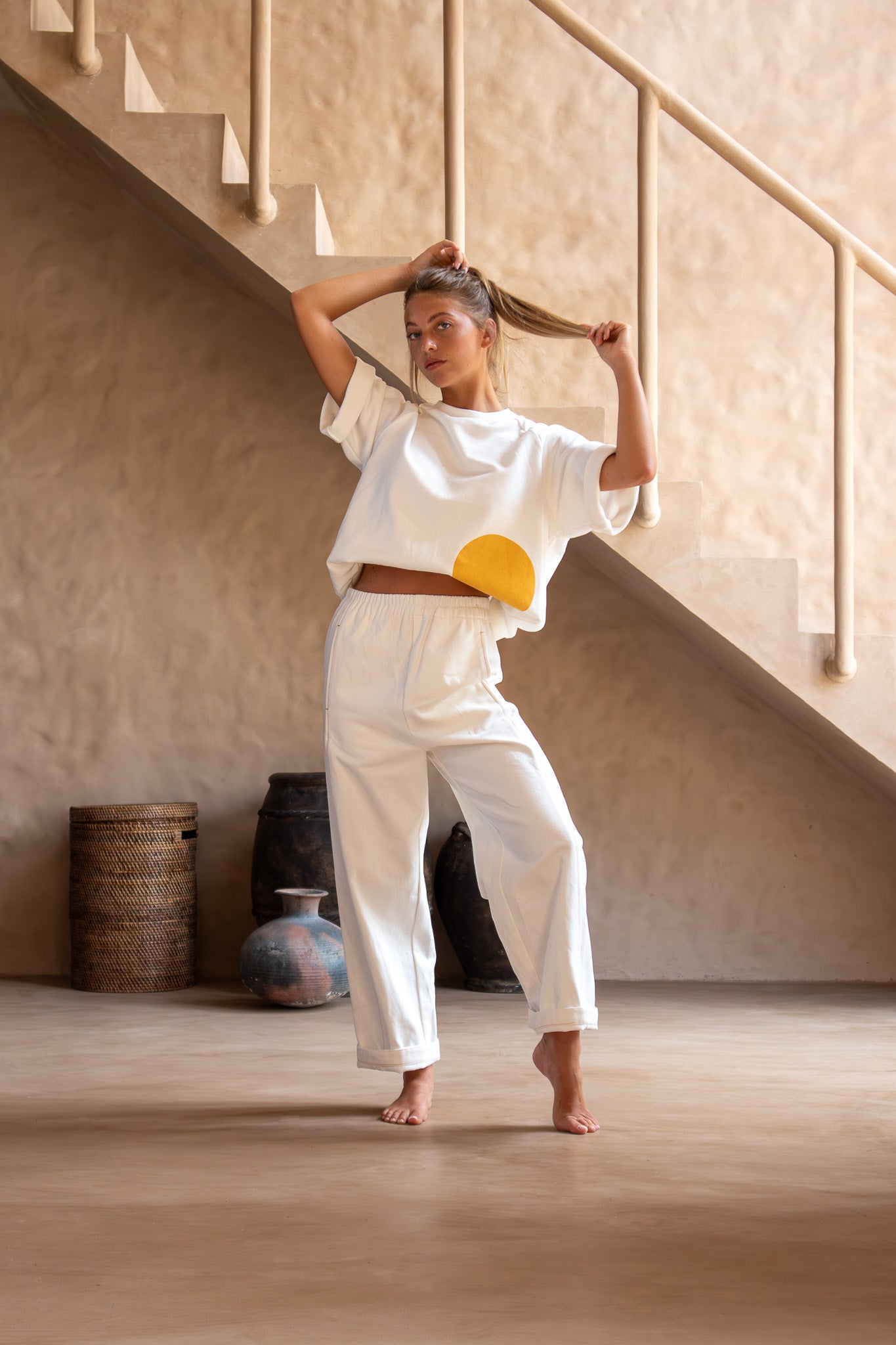 Model wears Blaze Jogger pants with wide waistband and Double Dot tee, facing forward.