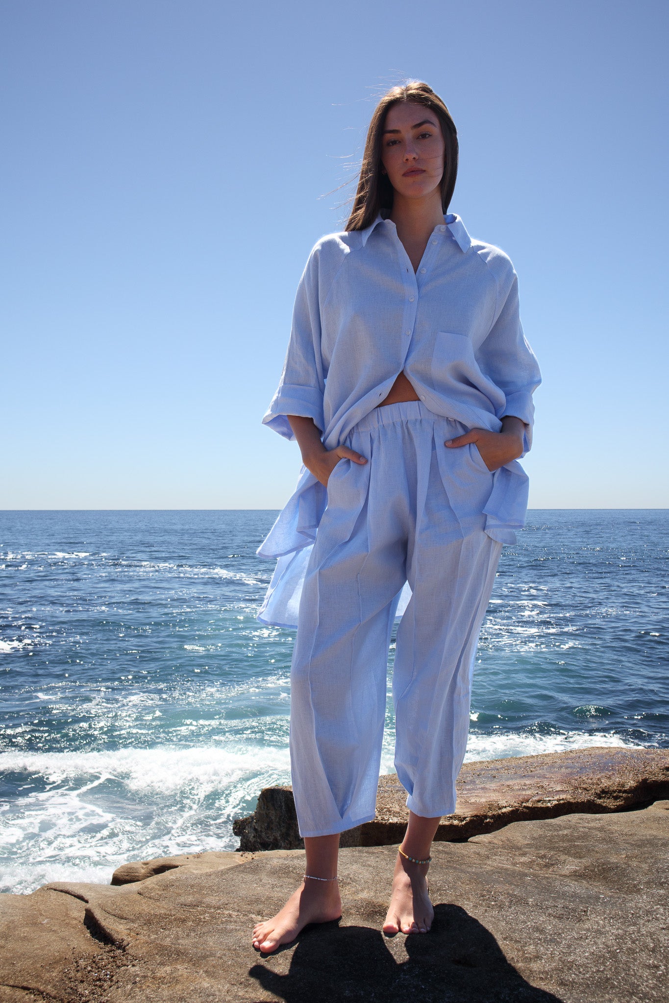 Full front view of the Oceanic Shirt in sail boat worn by model by the water