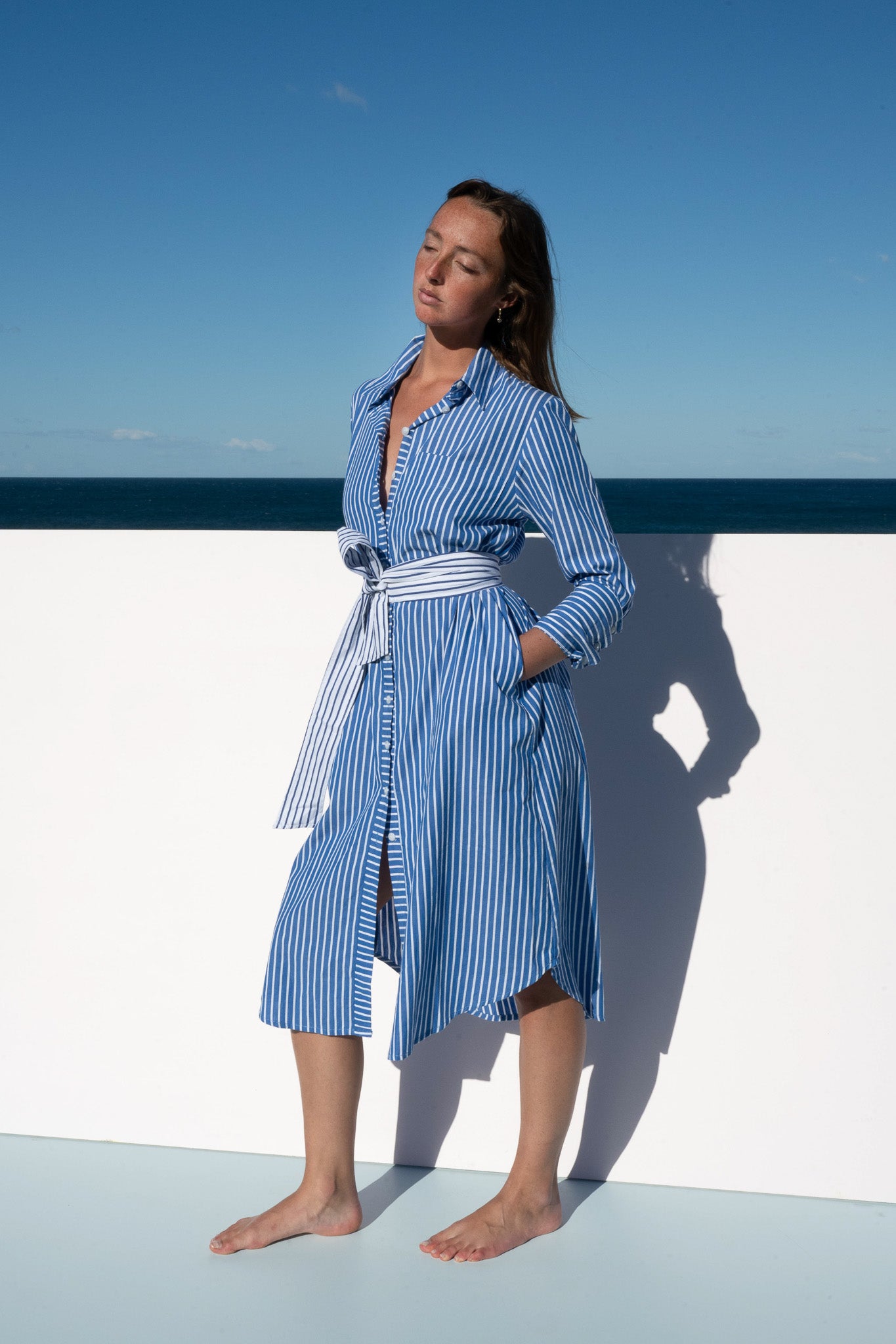 The Boy & I Bronte Dress in blue and white stripe, front angle view with waist tie.