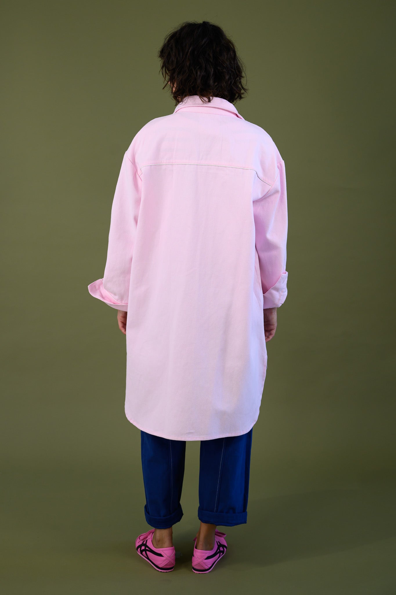 Womens pink canvas denim jacket back view showing longline relaxed fit and full length