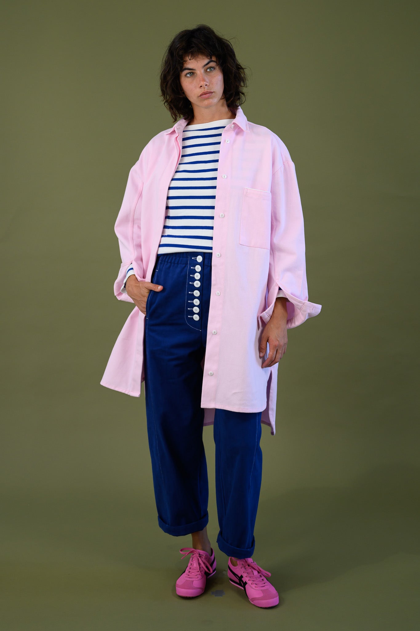 Womens pink canvas denim jacket casual outfit with blue pants and striped top relaxed styling