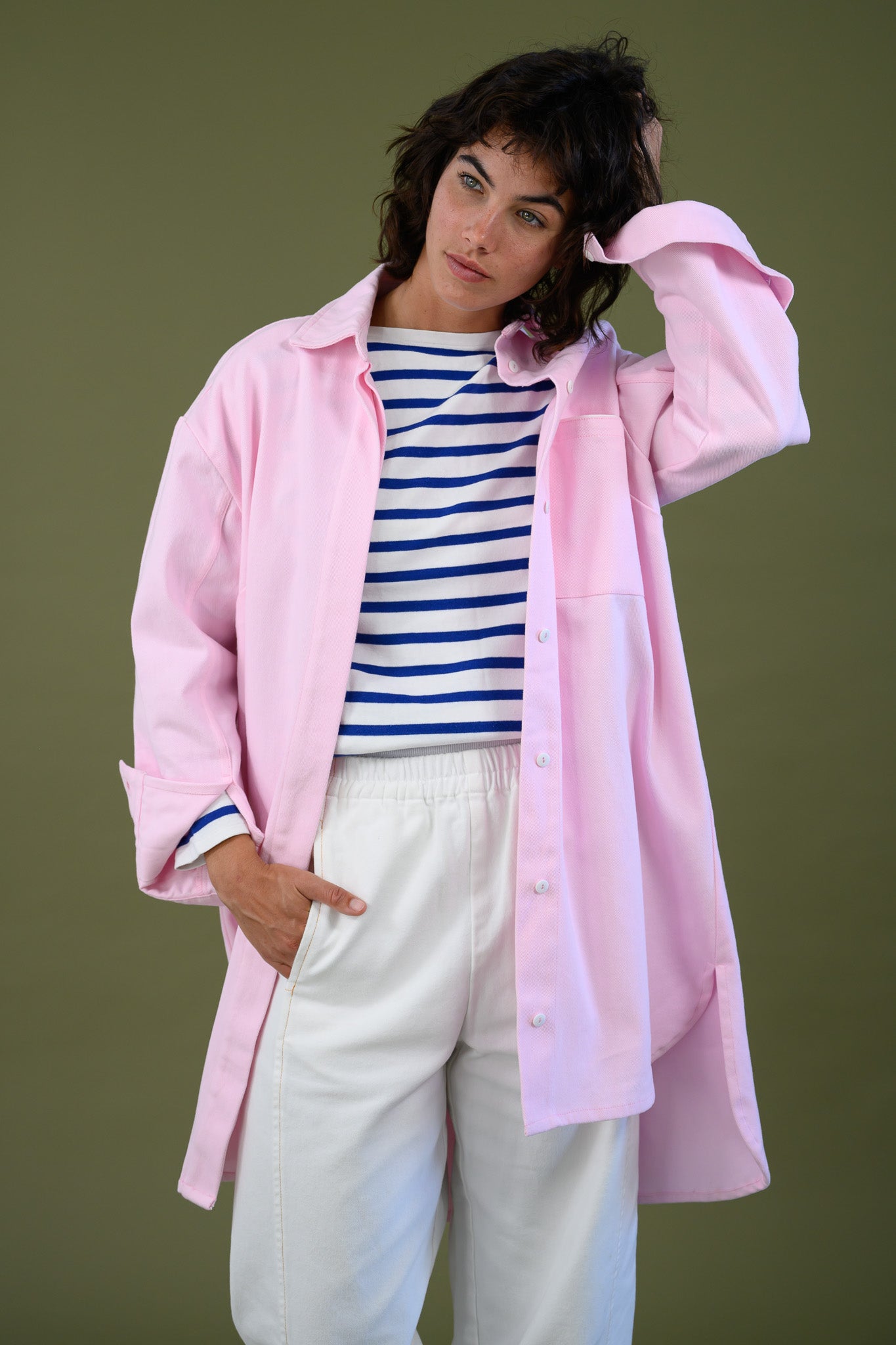 Womens pink canvas denim jacket relaxed fit mid length styled with striped top and white pants