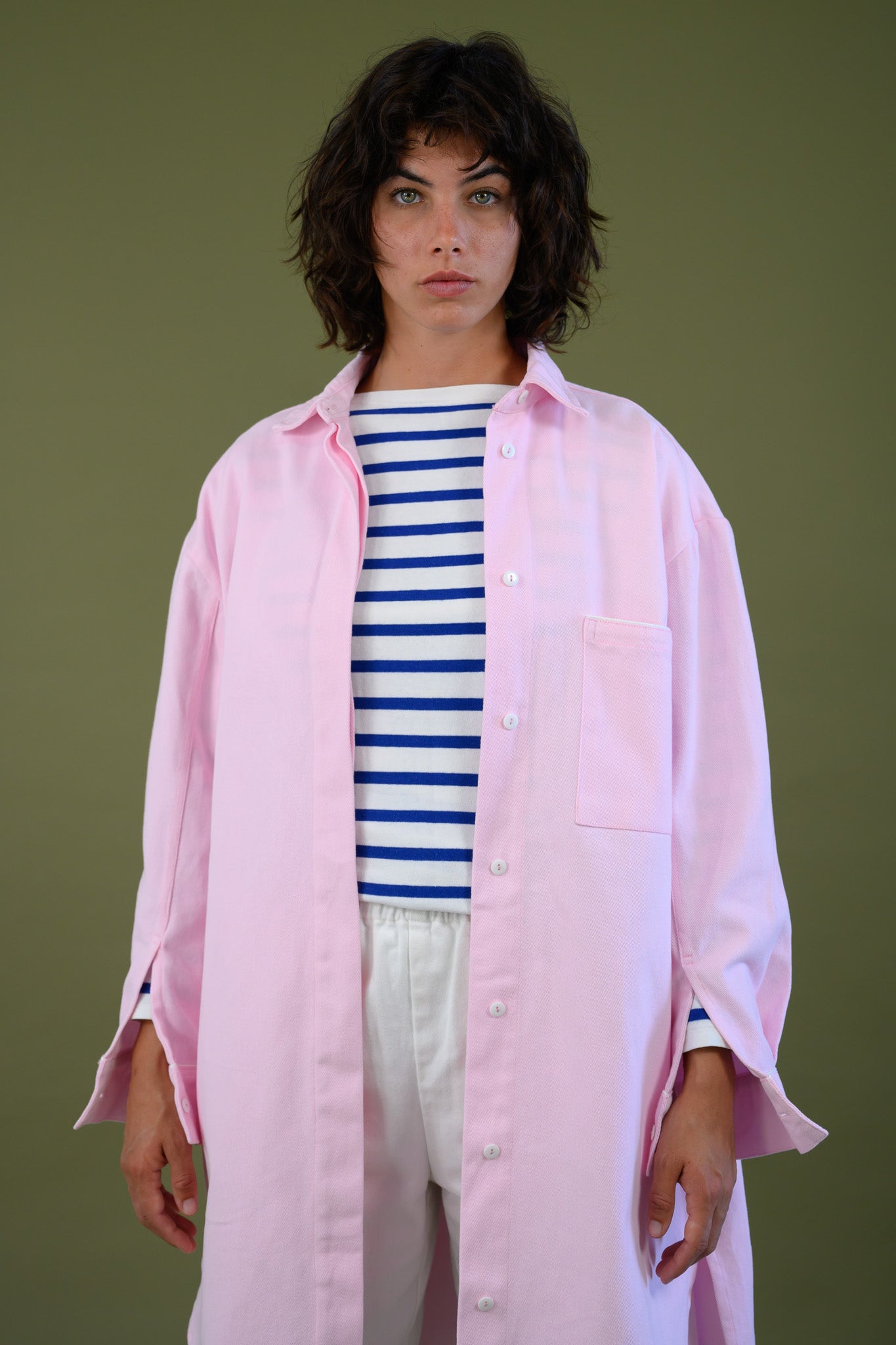 Womens pink canvas denim jacket upper body front view showing collar buttons and relaxed fit styling