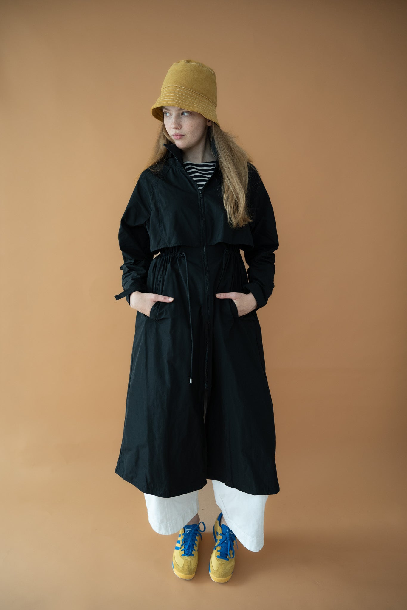 Full-length front view of the Cloud Breaker raincoat with drawcord waist and side pockets