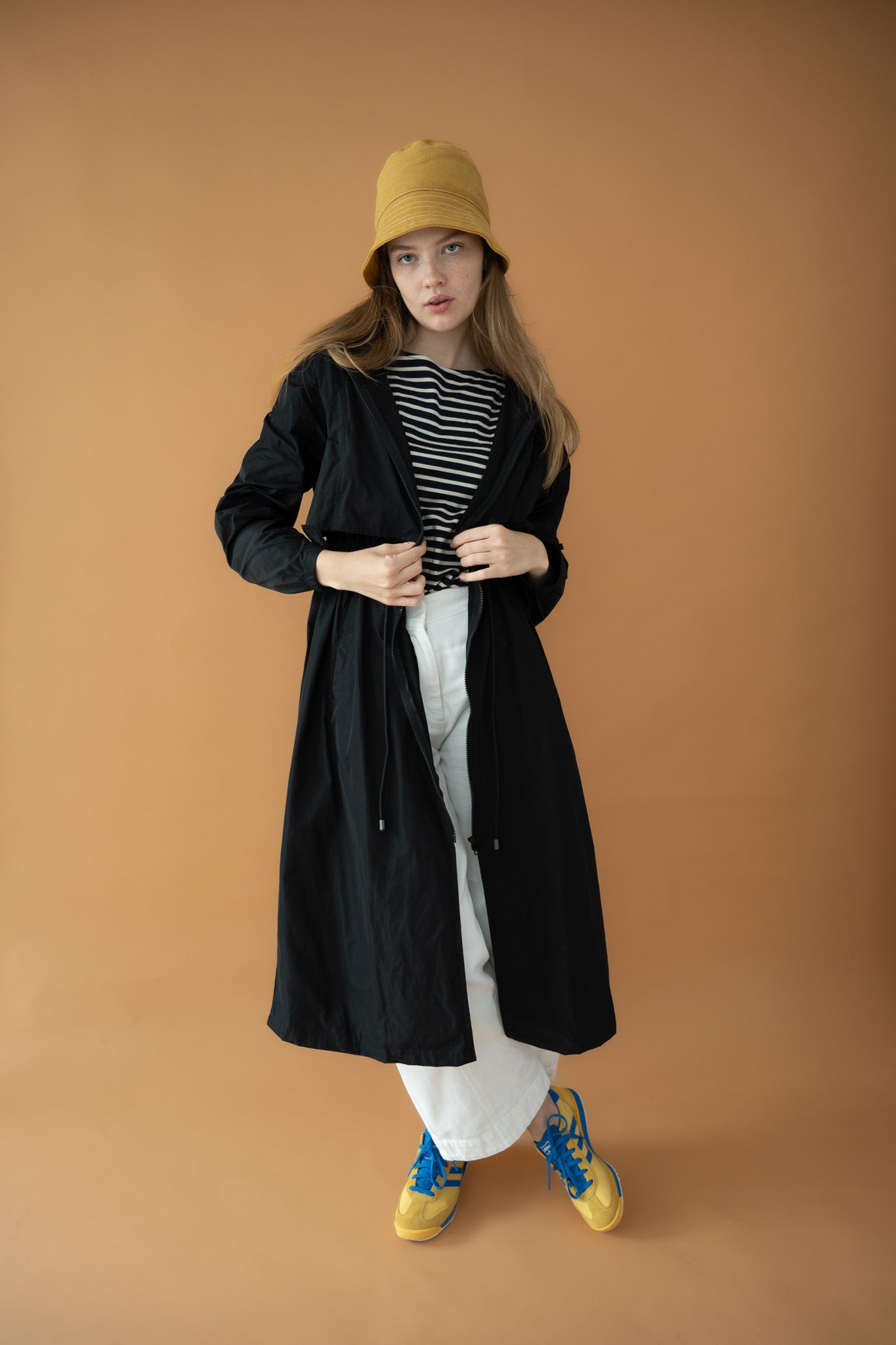Cloud Breaker raincoat unzipped to reveal striped tee and relaxed weekend styling

