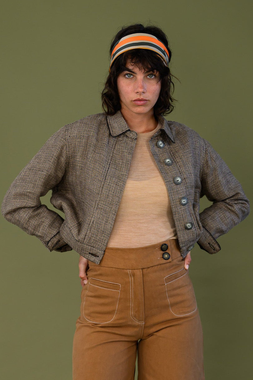 Cropped check jacket front view showing button detail and fitted waist
