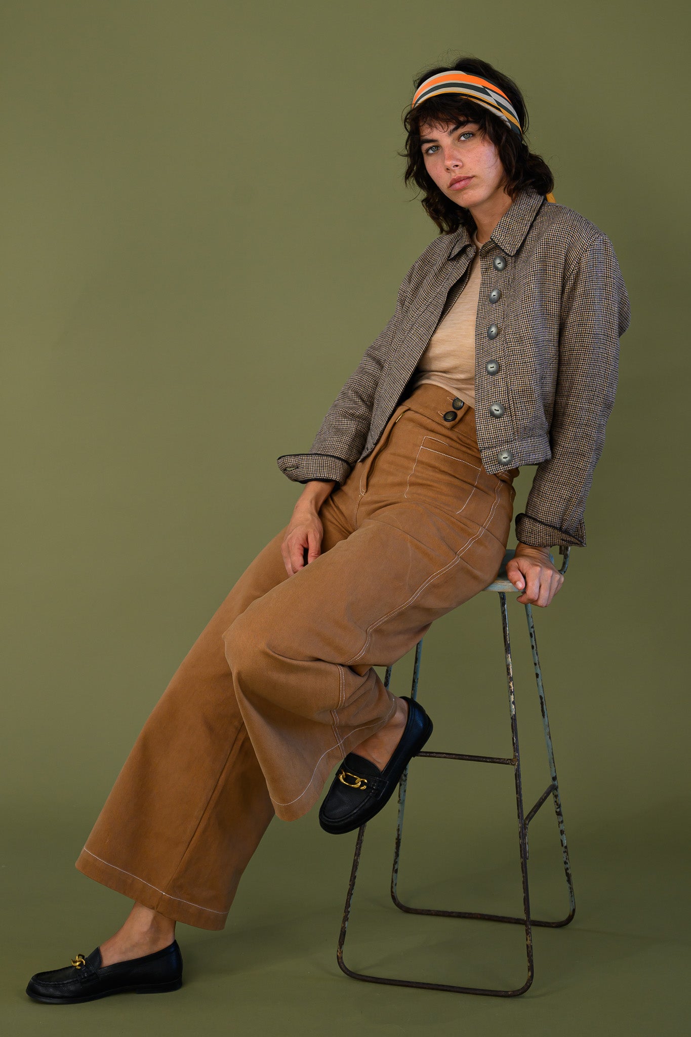 Cropped check jacket styled seated look with wide leg pants and relaxed fit