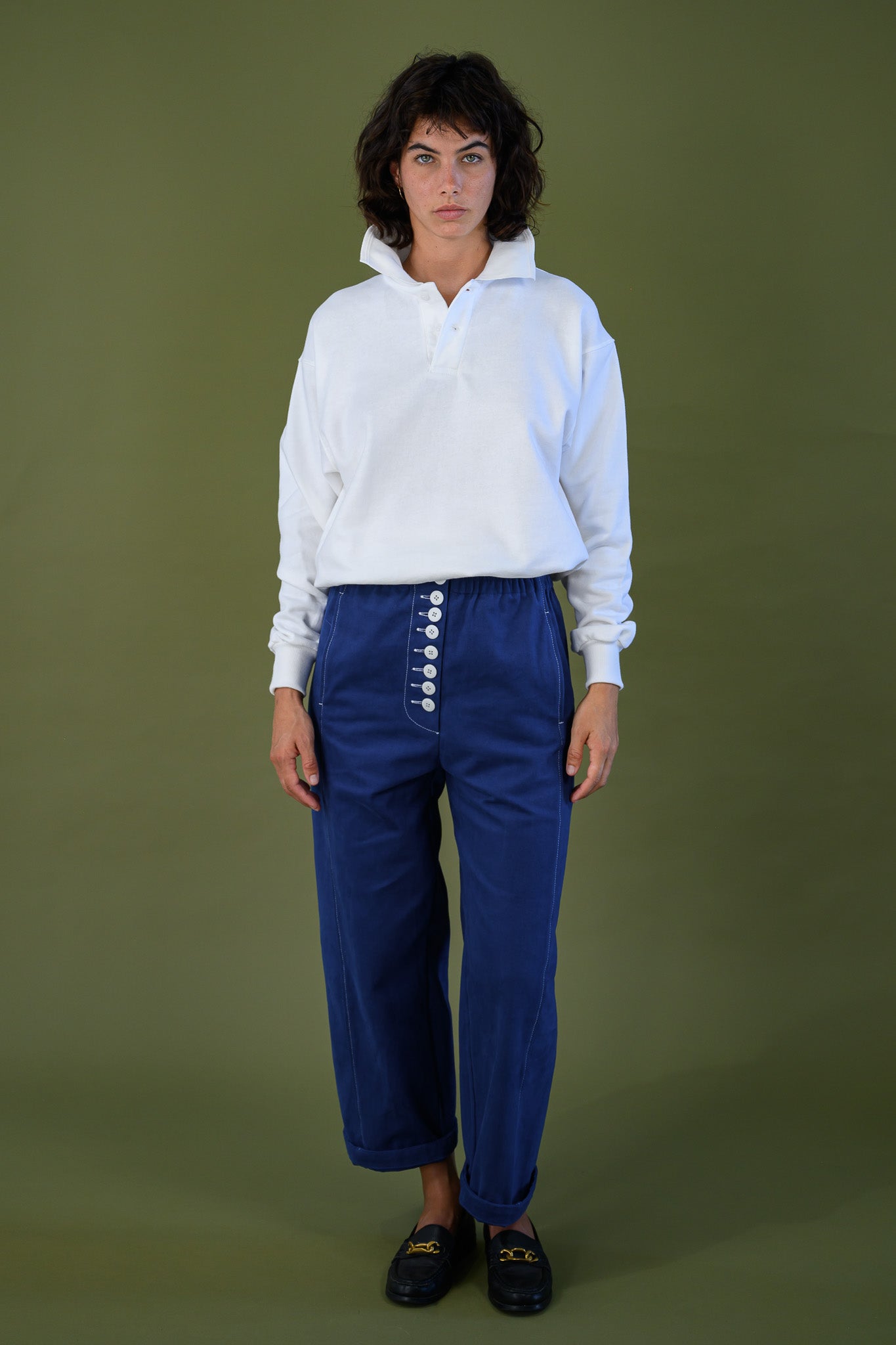 Full length front view of French navy cotton twill button pants showing high waist, straight barrel leg and button front detail