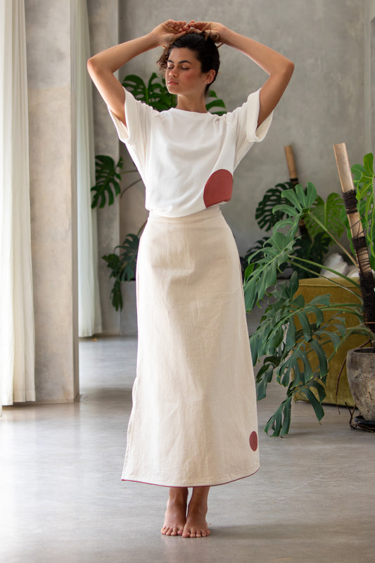 Model holding hands above head posing in beautiful Japanese denim designer skirt  