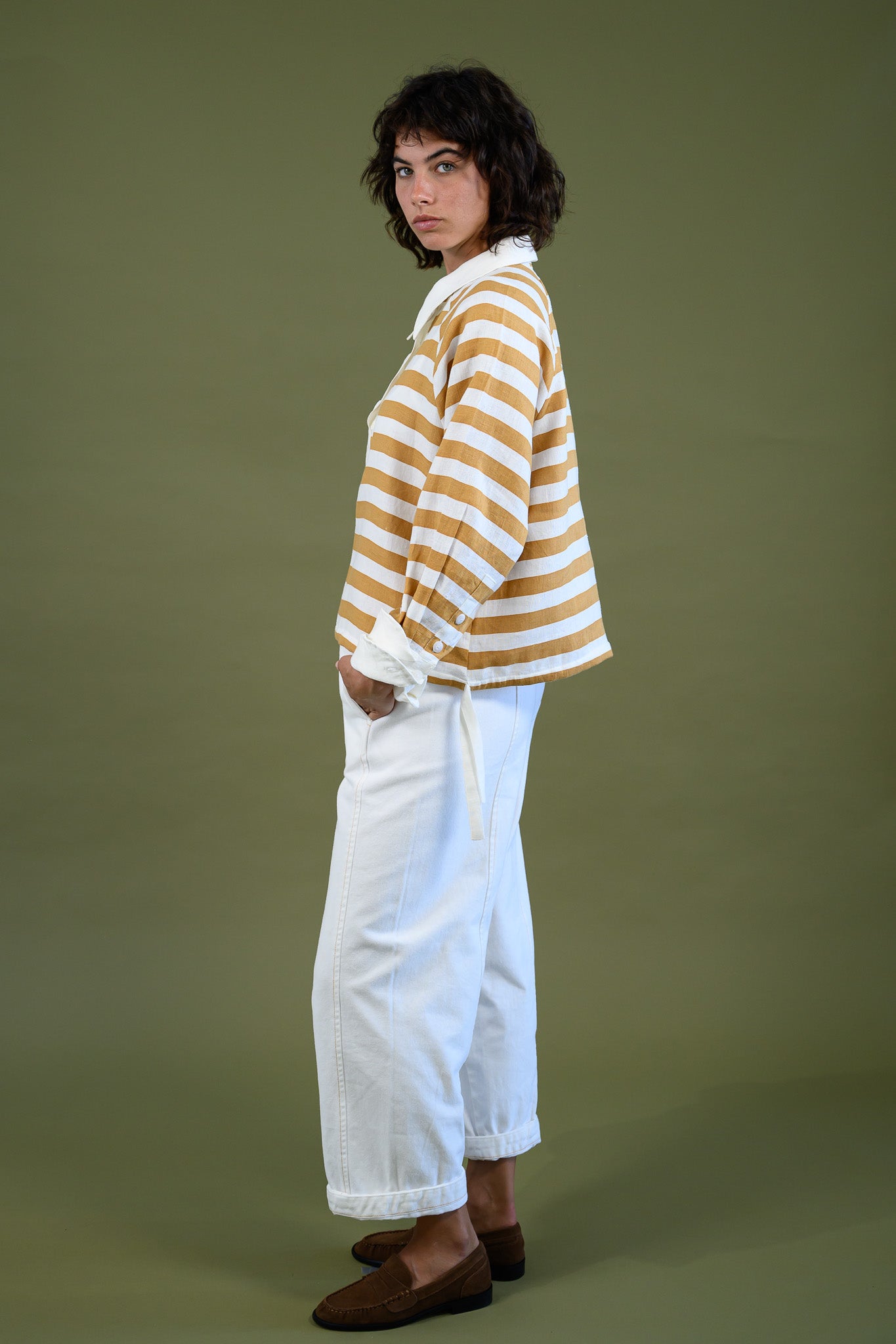Harrington shirt mango stripe linen side view full body styled with white pants showing relaxed silhouette, stripe pattern and soft structure