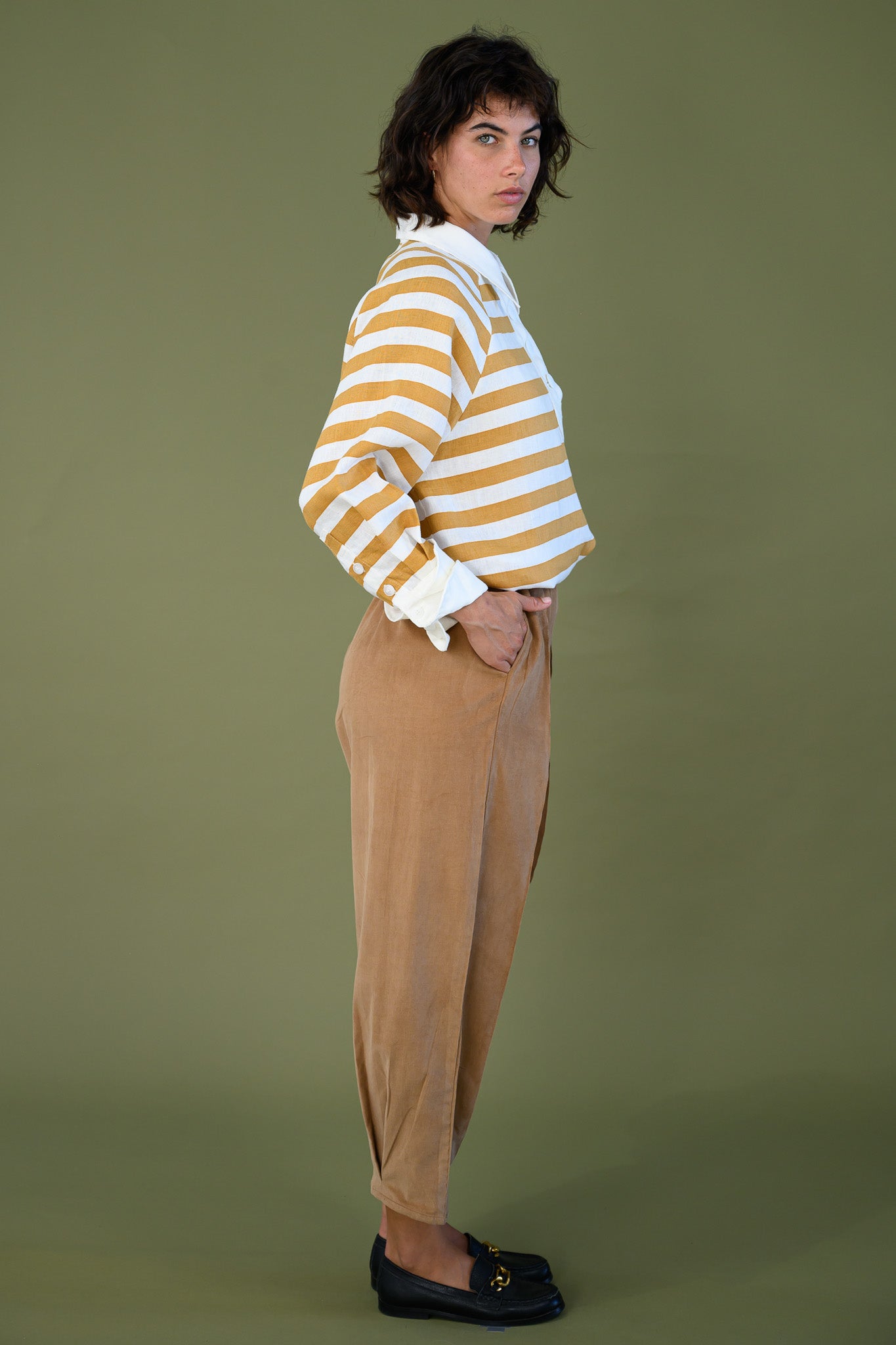 Harrington shirt mango stripe linen side view styled tucked into pants showing relaxed fit, stripe pattern and clean silhouette