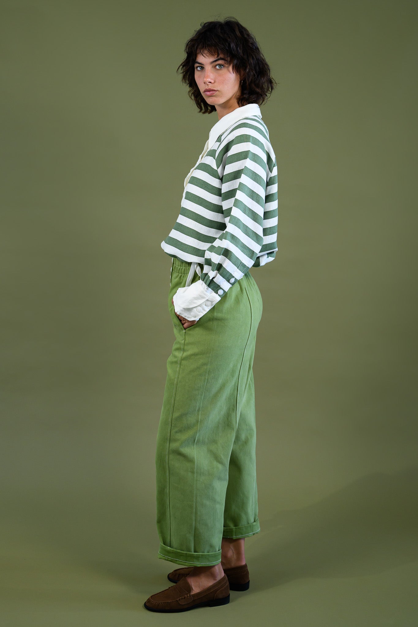 Harrington shirt meadow green stripe linen side full body view showing relaxed fit, drape and everyday silhouette