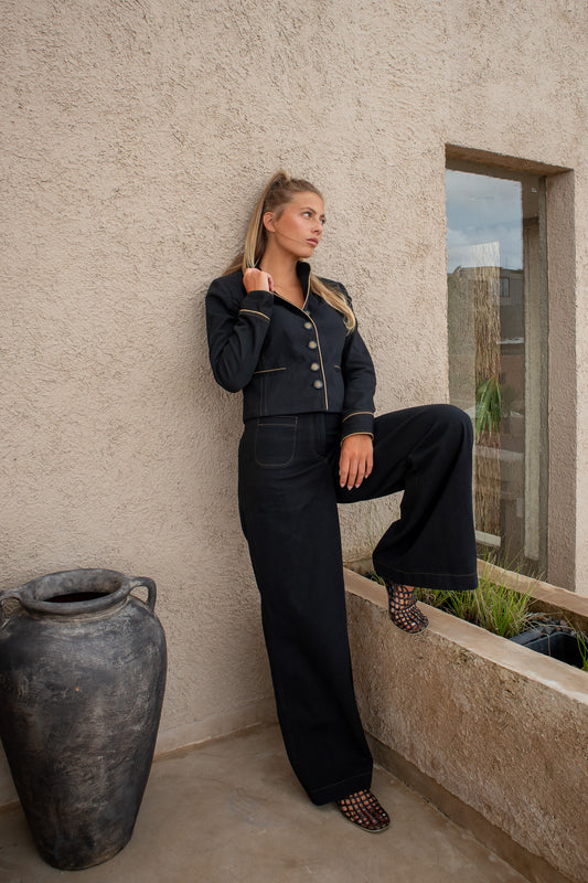 Side view of Celine Pant with gold topstitching and wide-leg fit – organic cotton denim