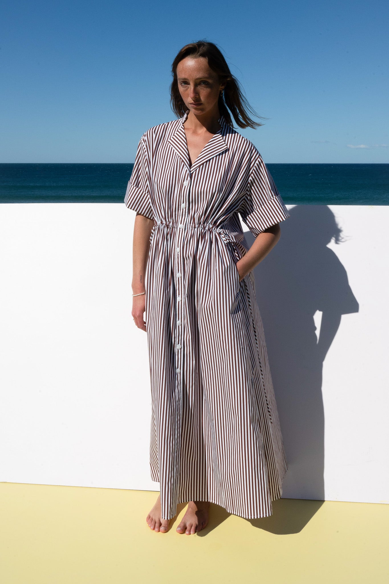 Full-length front view of The Boy & I Leon Dress in espresso stripe, styled effortlessly for summer wear.