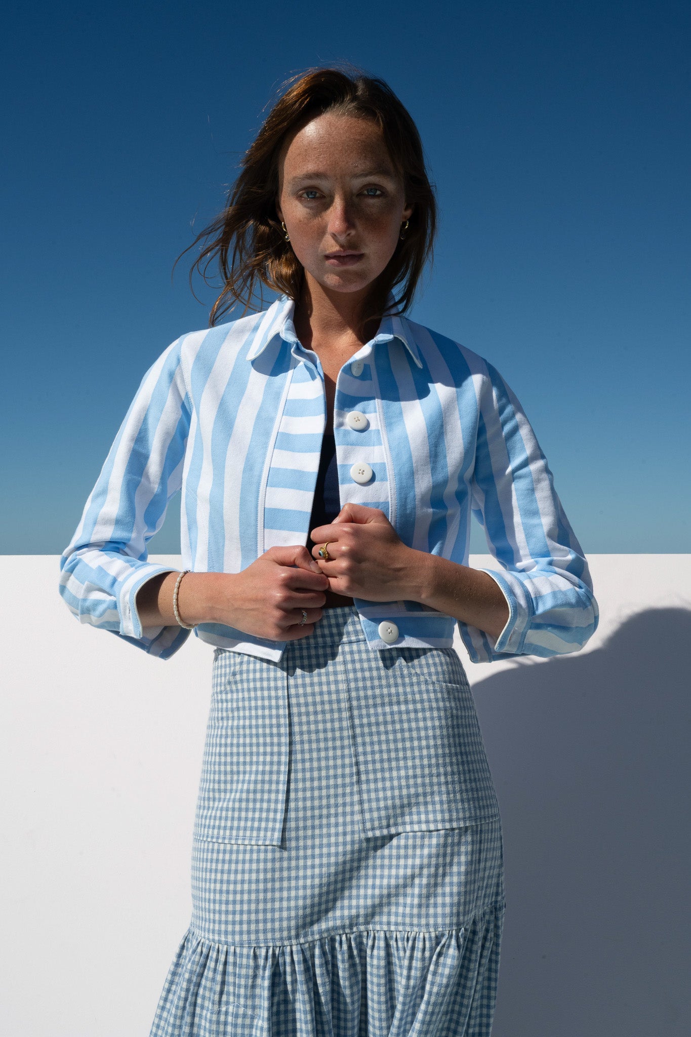 Close-up of Mon Petit Jacket Saltwater Stripe showing bold blue and white stripes with oversized white buttons.