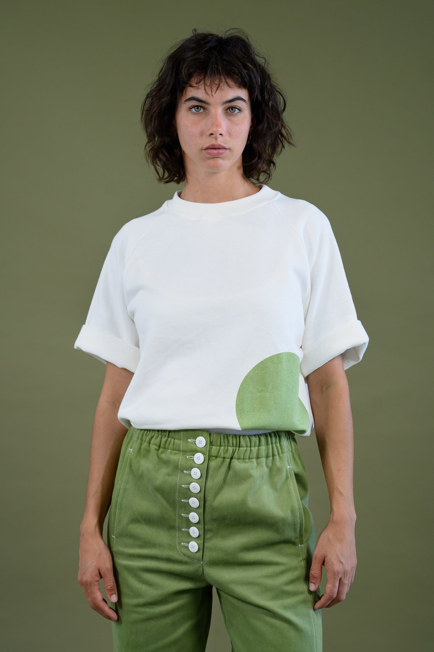 Womens white raglan sleeve cotton sweatshirt with dot detail shown in front view highlighting relaxed fit