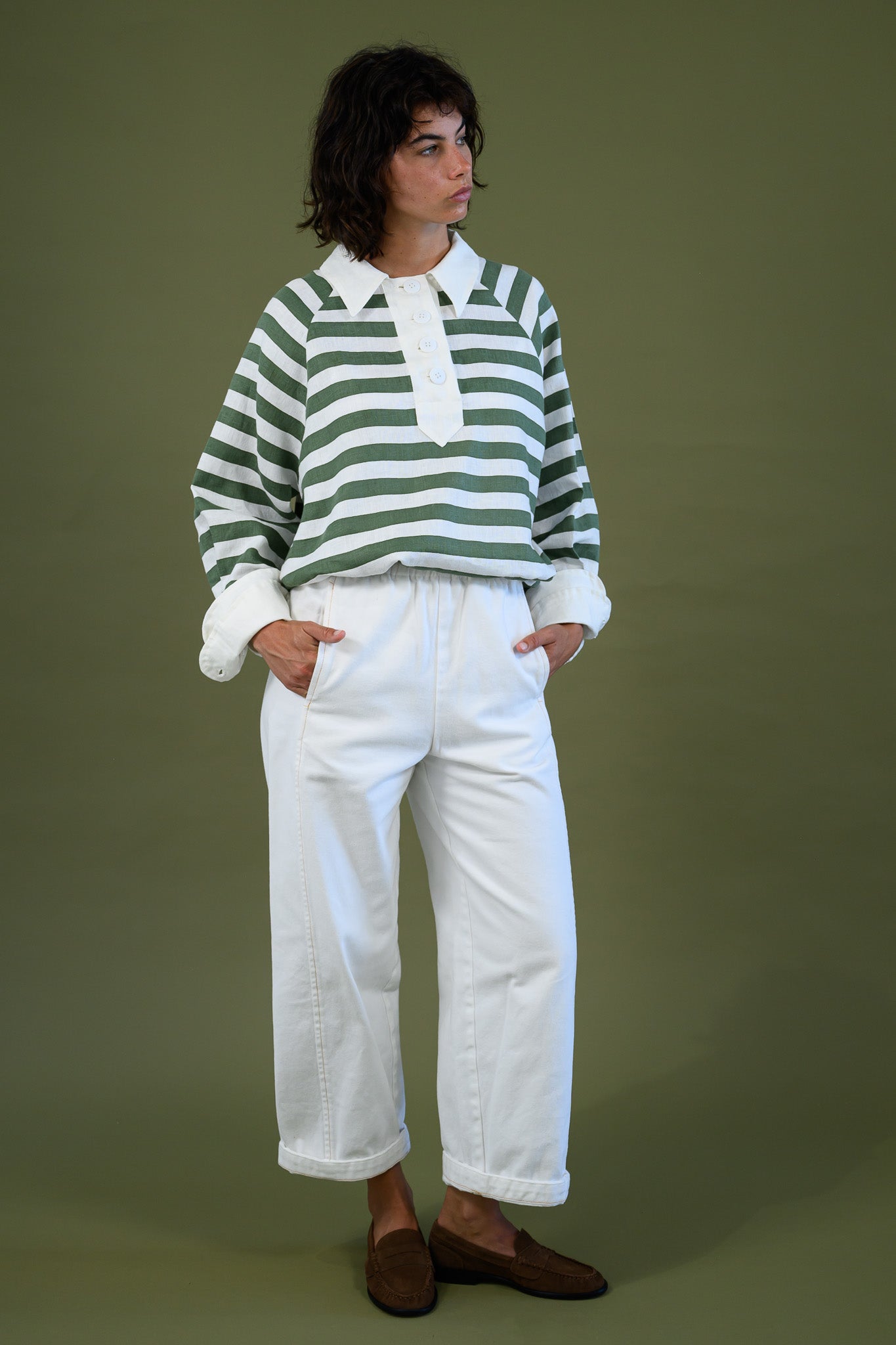 Blaze jogger in white organic cotton twill with a relaxed barrel leg fit styled with green stripe rugby shirt