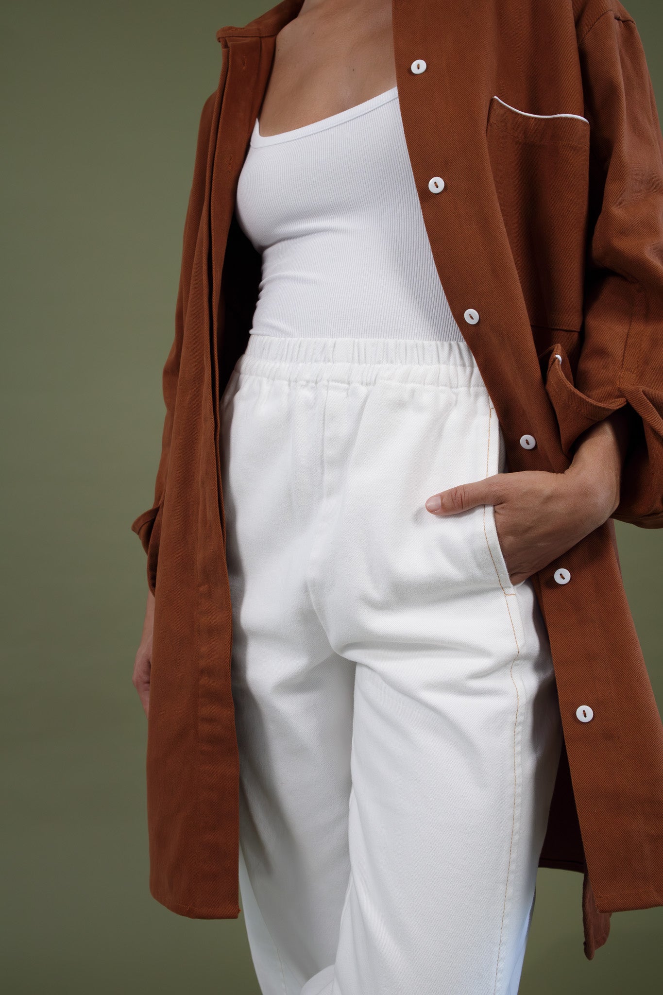 Blaze jogger in white organic cotton twill showing elastic waistband and side pocket detail