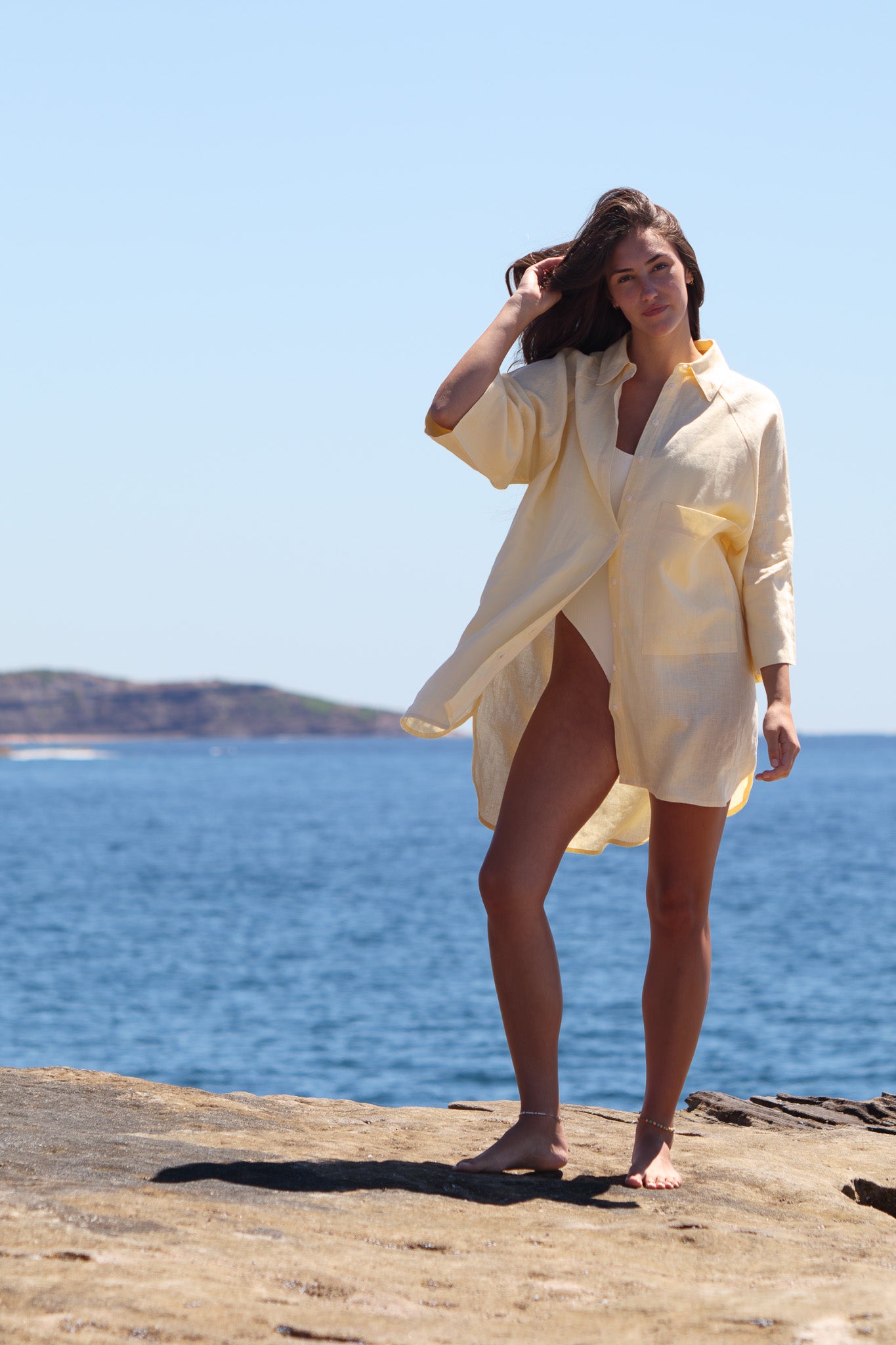 Oceanic Shirt Dress in butter yellow showing the oversized linen fit and x large chest pocket.