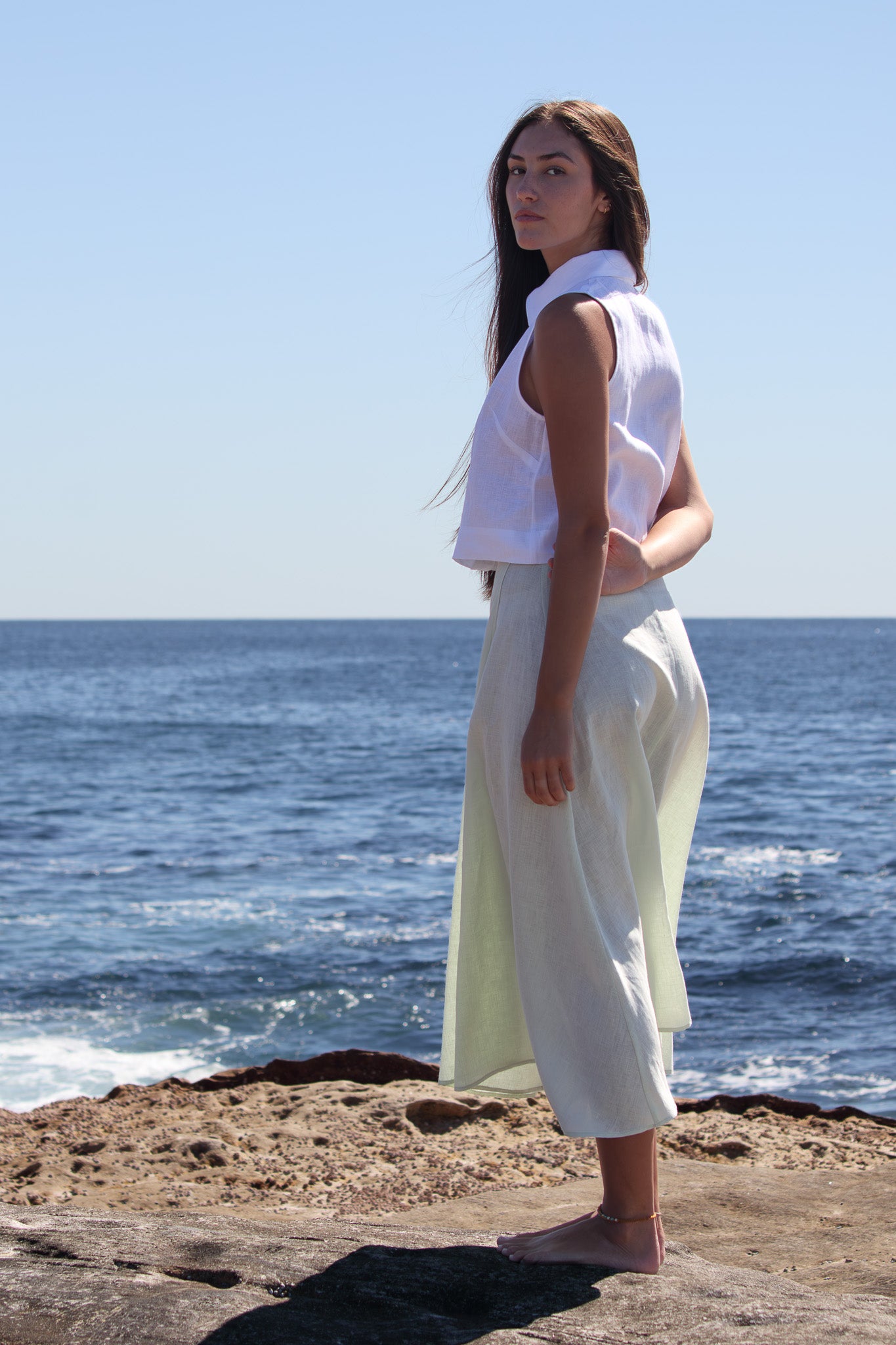 Wrap Around Me Skirt in sun washed mint photographed from a side angle highlighting the movement of the linen.