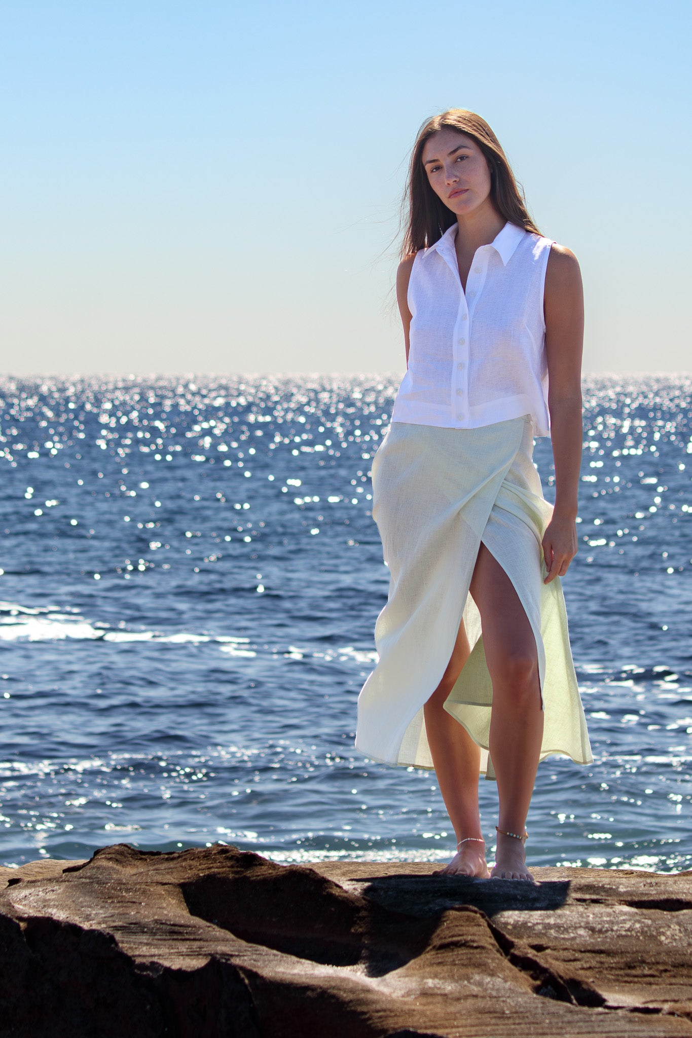 Front view of the Wrap Around Me Skirt in sun washed mint with the wrap front opening and soft movement by the ocean.