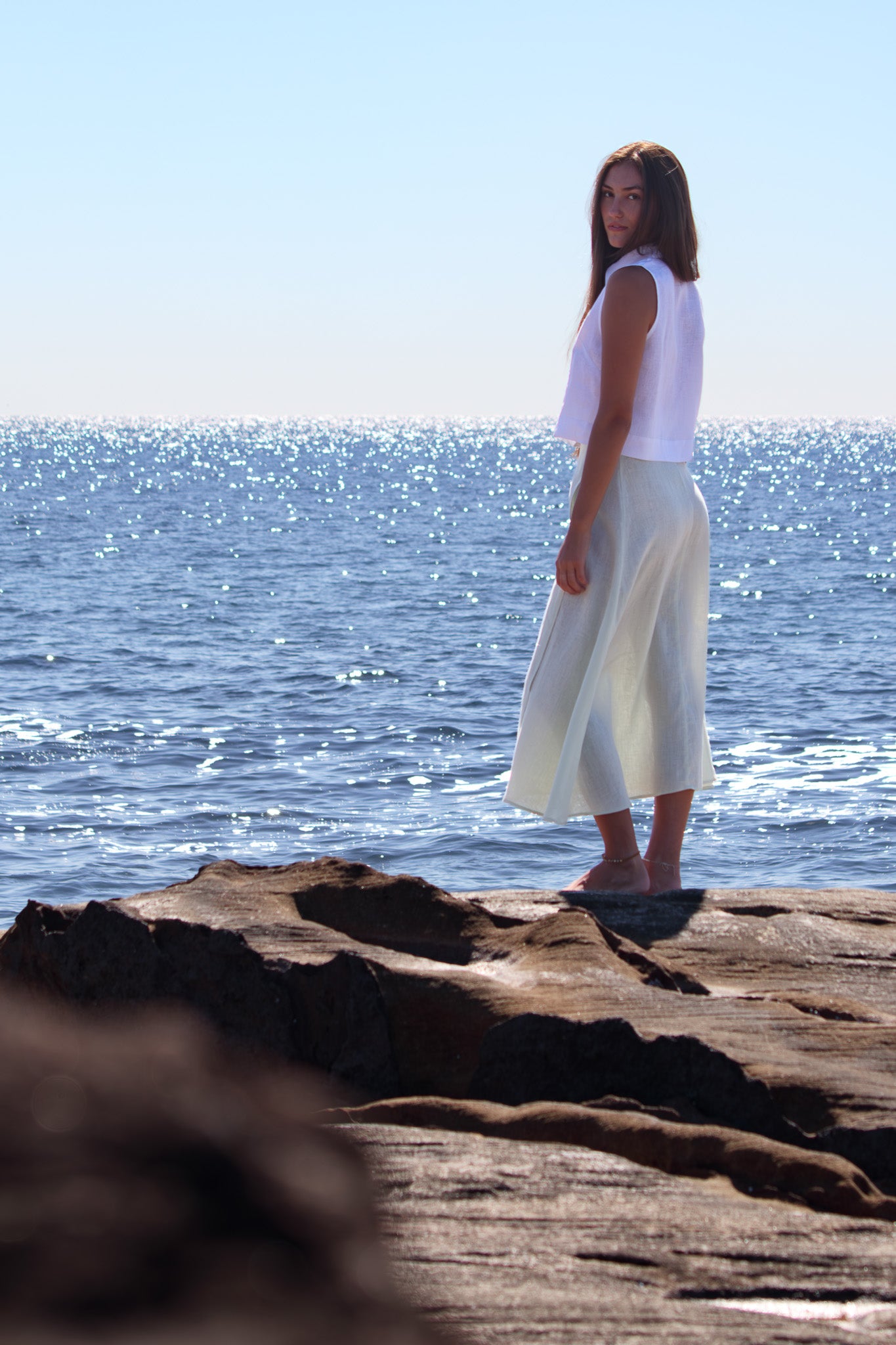 Wrap Around Me Skirt in sun washed mint photographed from a three quarter angle with a relaxed A line shape.