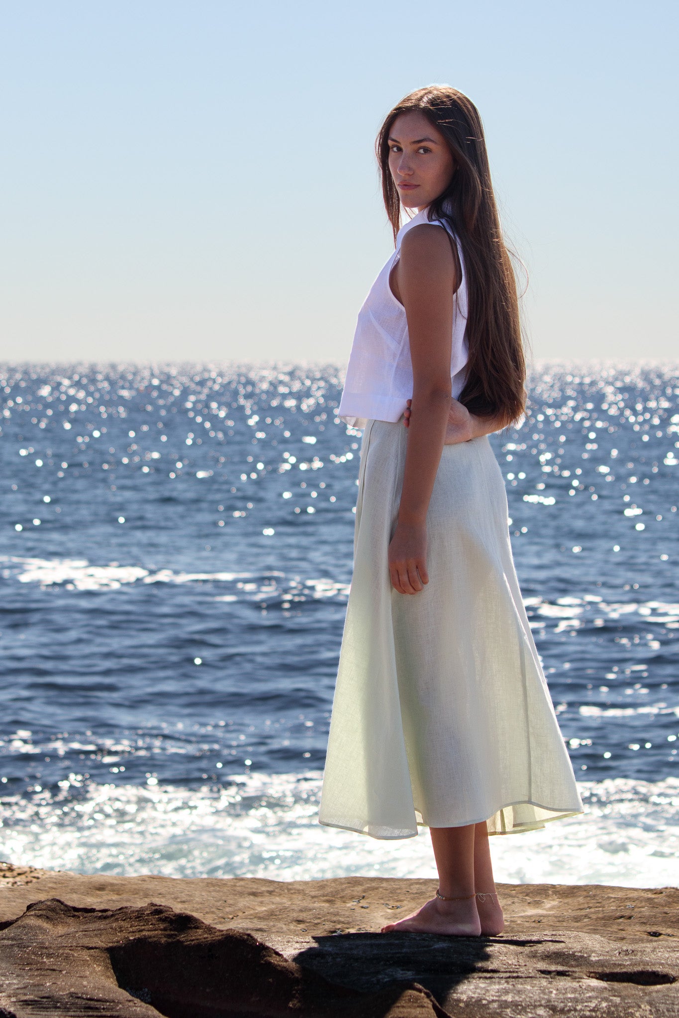 Wrap Around Me Skirt in sun washed mint linen shown from the side with soft A line drape.
