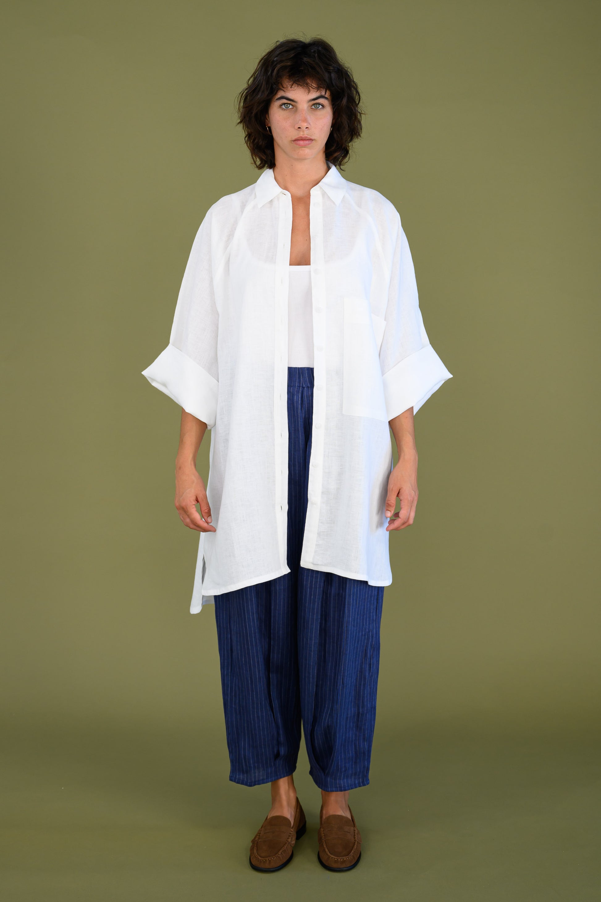 Front view of white linen shirt dress styled for a relaxed everyday look
